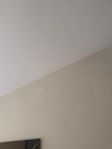 a room with white walls and a white ceiling at Woning in Damme nabij Brugge in Damme