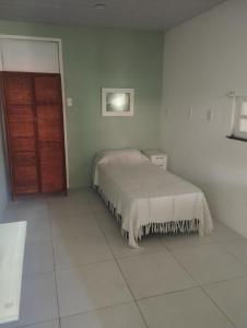 Postel nebo postele na pokoji v ubytování Zen Villas - Seu Refúgio Perto de Salvador