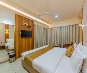 Ένα ή περισσότερα κρεβάτια σε δωμάτιο στο Hotel Kiyara