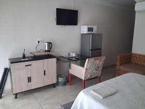 Kuchyň nebo kuchyňský kout v ubytování Khahliso Guesthouse