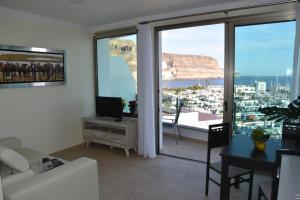 A television and/or entertainment centre at Sunset Puerto de Mogan