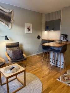 a living room with a couch and a table at Gästhuset i Åre in Åre