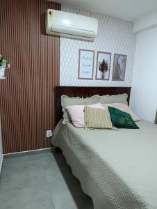 a bedroom with a large bed with ailver at Flat 402 Centro Porto Galinhas in Porto De Galinhas +41 photos