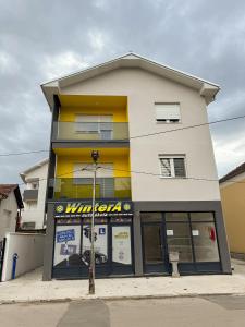 a store front of a building with a gas station at APARTMAN ANASTASIJA i DANKA in Pirot