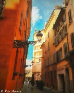a view of an alley between two buildings at B&B san Biagio parma in Parma