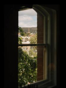 a view of a city from a window at Gibson Mill Penthouse with private balcony - 301 in Hobart