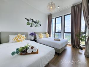 a hotel room with two beds and a window at Spacious Cozy Elysia Suite Johor Bahru Legoland in Iskandar Puteri +132 photos