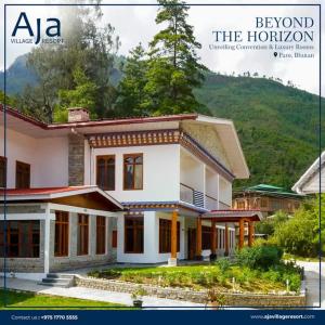 Aja Village Resort في بارو: غلاف مجلة لمنزل يقع أمام جبل