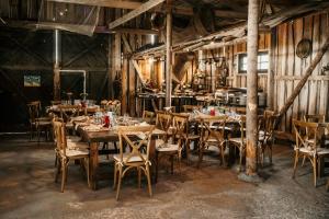 a dining room with wooden tables and chairs at Matsi Maria Big in Matsi