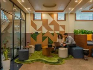 two people sitting at a table in an office at The Hosteller Agra, Tajganj in Agra +25 photos