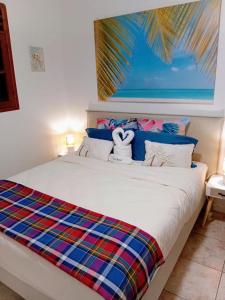 a bedroom with a bed with a view of the ocean at Vi la dous Kreyol in Sainte-Rose