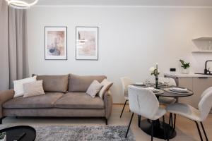 a living room with a couch and a table at Siili Riverview Stay in Tartu