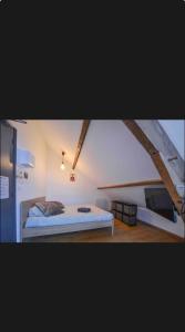 a bedroom with a bed in a room at Velours & Balnéo in Saint-Nazaire +35 photos
