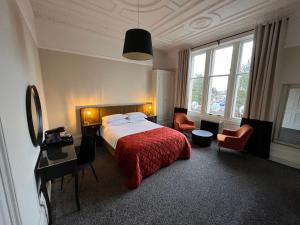 Postel nebo postele na pokoji v ubytování The Graeme Hotel + 9 fotografií