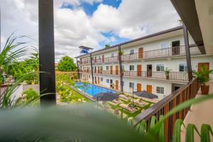 a view from the balcony of a hotel with a swimming pool at Bayview Garden Resort in Panglao Island