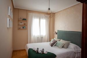 Ένα ή περισσότερα κρεβάτια σε δωμάτιο στο Casa Senda by Cardi Suites