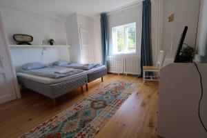En eller flere senge i et værelse på Family & Worker Accommodations in Göteborg