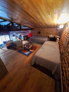 En eller flere senge i et værelse på La Forja Garage