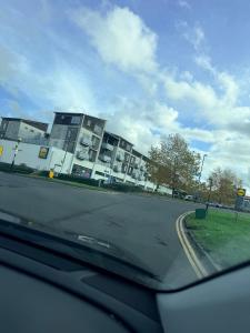 a view from a car of a street with buildings at Warn Cossy Luxe Room in Addington