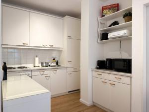 Køkken eller tekøkken på Cosy Getaway mit Schwimmbad und Sauna