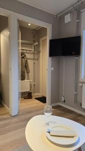 a room with a table with a wine glass on it at Tingsryd Resort in Tingsryd +48 photos