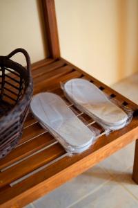 two trays are sitting on a wooden table at Bayview Garden Resort in Tagbilaran City