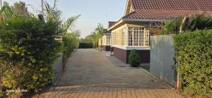 a brick road in front of a house at Armana Elite Homes in Paulo