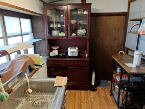 Kuchyň nebo kuchyňský kout v ubytování みぃちゃの家 Casa di Micia はなれ + 16 fotografií