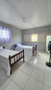 Postel nebo postele na pokoji v ubytování Casa por temporada em Penedo