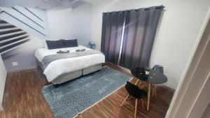 En eller flere senge i et værelse på Casa lux boutique guest house