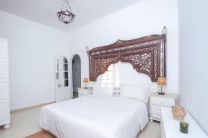 Кровать или кровати в номере Maison ltoile de Sidi Bou Sad - 360 Sea View