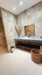 a bathroom with a large tub and a sink at Villa Sun 4 in Mae Nam