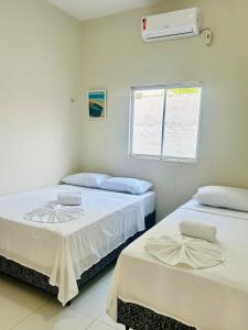 En eller flere senge i et værelse på Serena Jeri Flats