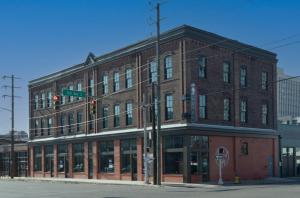 a large brick building on the corner of a street at The Painted Lady in Birmingham