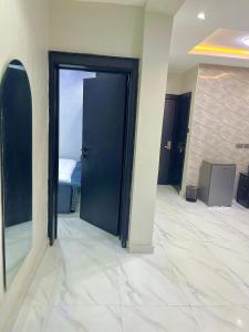 a room with a door with a bed in it at Fadaka Manor in Ibadan