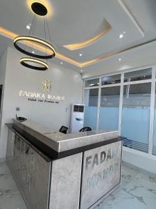 a lobby with a reception desk in a store at Fadaka Manor in Ibadan +6 photos