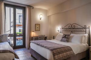 Una cama o camas en una habitación de Hotel Il Tiglio