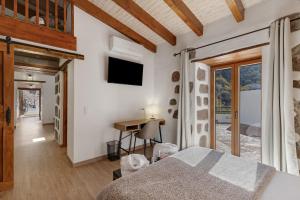 En eller flere senge i et værelse på Casa rural La Pelusa