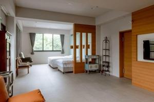 Ένα ή περισσότερα κρεβάτια σε δωμάτιο στο A Shin Tainan Hostel