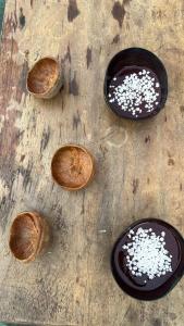 a group of bowls of food on a wooden table at Hotel Arara Azul in Manaus