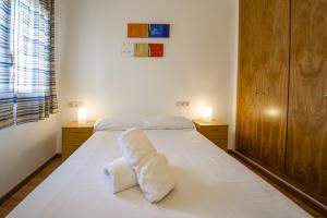 Ένα ή περισσότερα κρεβάτια σε δωμάτιο στο Acogedor apartamento vacacional en La Molina - Alp