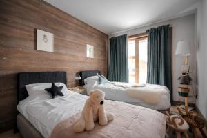 En eller flere senge i et værelse på Appartement Montalis - Welkeys