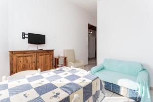 Una cama o camas en una habitación de Appartamento in villa 5 posti letto
