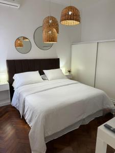 En eller flere senge i et værelse på PH Inmejorable Ubicación, Barrio Norte