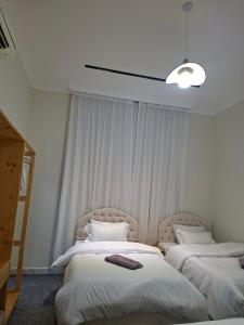 Postel nebo postele na pokoji v ubytování farm house khorfakkan al Fujairah + 12 fotografií