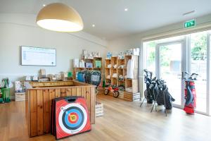 a store with a target in the middle of a room at The Mole Resort - Lodges in Chittlehamholt +72 photos
