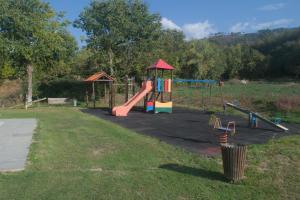 a park with a playground with a slide at Casas da Travessoa in Marco de Canaveses