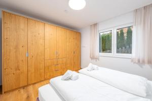 Кровать или кровати в номере Drei Berge Blick - by myNests