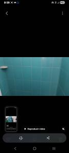 a television screen with a picture of a ship at Hospedaje el floral in Tolú