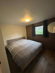 En eller flere senge i et værelse på Casa op de Veluwe